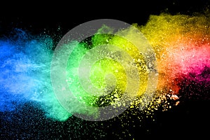 Vibrant color powder explosion cloud isolated on black background.