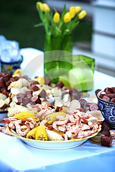 Vibrant color with yellow flowers and a delicious low country shrimp boil.