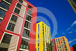 Vibrant colorful apartment estate exterior facade foreshortening from below