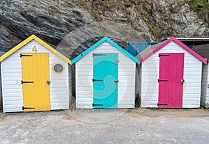 Vibrant colorful beach huts in a row