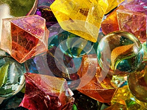 Vibrant colorful marbles and stones, colorful glass orbs, close-up background with selective focus