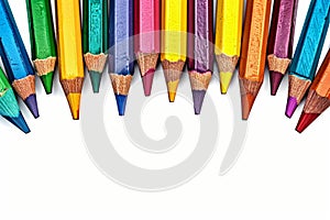Vibrant creativity colorful crayons frame border on a white background