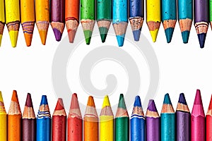 Vibrant creativity colorful crayons frame border on a white background