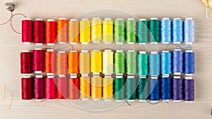 Rainbow Thread Spools arranged in Rainbow Gradient on Craft Table