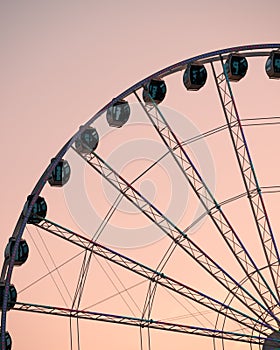 Vibrant Ferris wheel against a beautiful backdrop of a sunset sky on Myrtle Beach