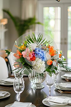 Vibrant floral centerpiece on a dining table set for a festive occasion