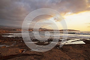 Vibrant, golden sunrise over the limestone coasts of El Medano, Tenerife, Canary Islands, Spain