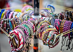 Vibrant handcraft bracelets at a busy marketplace