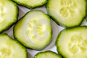 Fresh cucumber slices, closeup, top view. photo