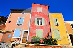 Vibrant houses of Rousillon, Provence, France with red and yellow colors photo