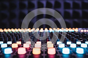 Vibrant lights of sound mixing console showcase creativity and precision in audio production