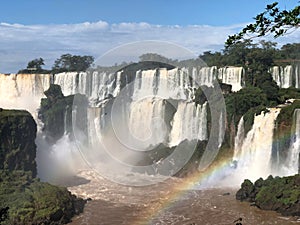 Vibrant and majestic Iguazu waterfall cascading down amidst a picturesque landscape in Argentina