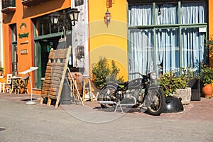 Vibrant Mediterranean Architecture with an old vintage  motorcycle