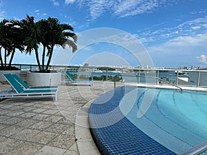 Vibrant outdoor swimming pool surrounded by deck chairs in Miami