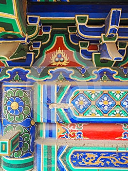 Vibrant painted roof and beams in a Chinese taoist temple