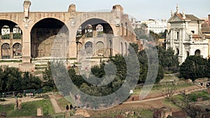 Vibrant panorama of Rome in Italy includes a wide range of ancient buildings, Arch of Titus, Colosseum on the background