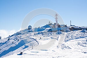 Vibrant panorama of the slopes at ski resort Kopaonik, Serbia, snow trees, blue sky