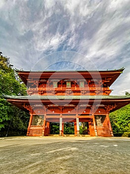 The vibrant red Daimon gate functioning as the entrance to the famous pilgrimage town Koyasan in Wakayama, Kansai, Japan