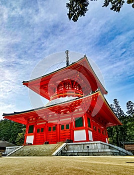 The vibrant red Konpon Daito Pagoda in the Unesco listed Danjo Garan shingon buddhism temple complex in Koyasan, Wakayama, Japan