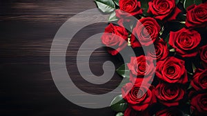 Vibrant red roses on dark wood wide background with copy space