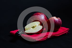 Vibrant red Royal Gala English apples on red tea towel