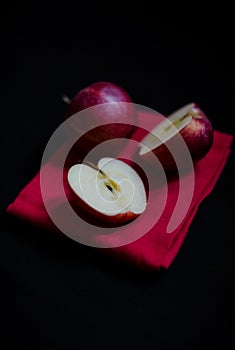 Vibrant red Royal Gala English apples on red tea towel