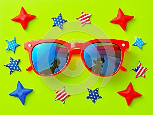Vibrant Red Sunglasses with Reflective Lenses Surrounded by Star Decorations on Bright Green Background for Summer and Patriotic