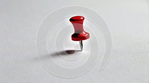 Red Thumbtack on White Background