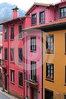 Vibrant row of buildings with mountain backdrop in urban neighborhood