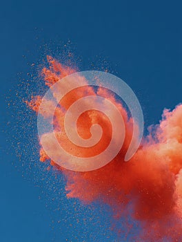 Vibrant Splash of Sindoor Powder Creating Dynamic Patterns Against a Clear Sky Backdrop photo