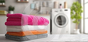 The vibrant stack of fresh towels in a bright laundry room. AI generated image