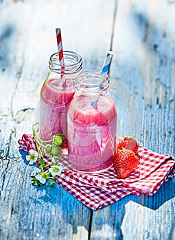 Vibrant strawberry smoothies summer picnic table