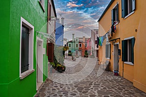 Vibrant Street Scene in Burano, Italy: Colorful Buildings and Lively Atmosphere