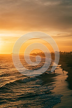 Vibrant sunset over the beach from the Balboa Pier, in Newport Beach, Orange County, California