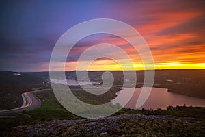 Vibrant sunset over St John`s Newfoundland, seen from the top of Signal Hill overlook.