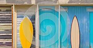 Vibrant Surfboard Facade Wall: A Splash of Color in Your Coastal Getaway.