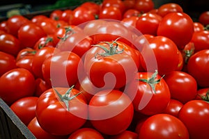 Vibrant tomatoes neatly arranged in a store drawer, marketfresh goodness