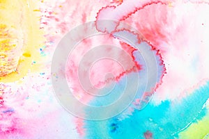 Vibrant Watercolor Paint on a White Background with Splatters and Blending Colours in Pretty Rainbow for Background