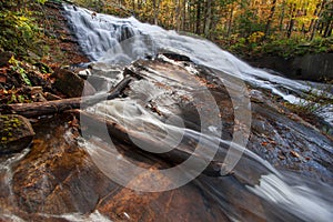 Vibrant waterfall in New England with fall foliage