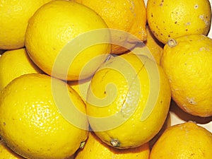 vibrant yellow lemons background photo