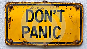 Vibrant Yellow Warning Placard Bearing the Assertive Phrase DONT PANIC Conveying a Directive to Stay Serene and Maintain
