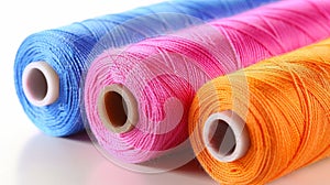 Vibrantly hued cotton threads on spools for diverse sewing and embroidery creations photo