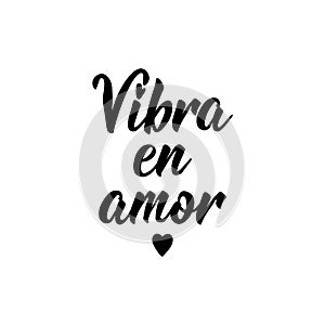 Vibrate in love - in Spanish. Lettering. Ink illustration. Modern brush calligraphy