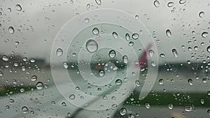 Vibrating drop of water on a plane window