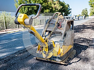 Vibrating plate on a construction site