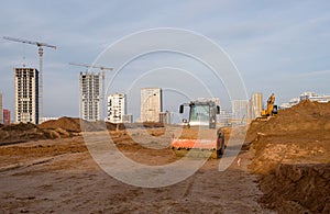 Vibration single-cylinder road roller leveling the ground for the foundation. Soil Compactor for laying asphalt