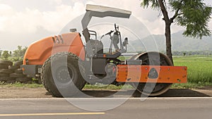 Vibration single-cylinder road roller leveling the ground for the foundation