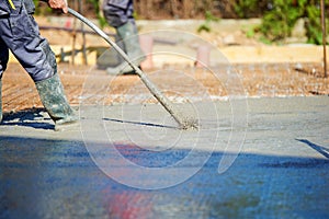 Concrete Vibrator being used on a construction site photo