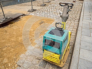 Vibratory plate on a building site