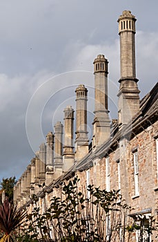 Vicars` Close, in Wells, Somerset UK. Street of medieval terraced houses with iconic chimneys behind Wells Cathedral.